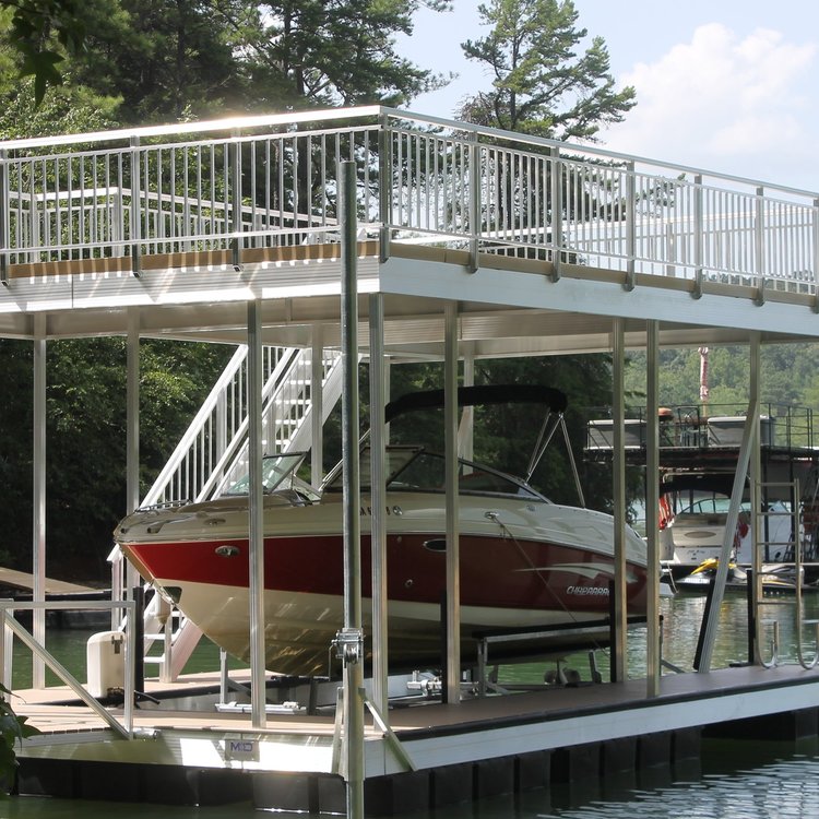 Scenic lake dock with a boat peacefully moored, surrounded by natural beauty.