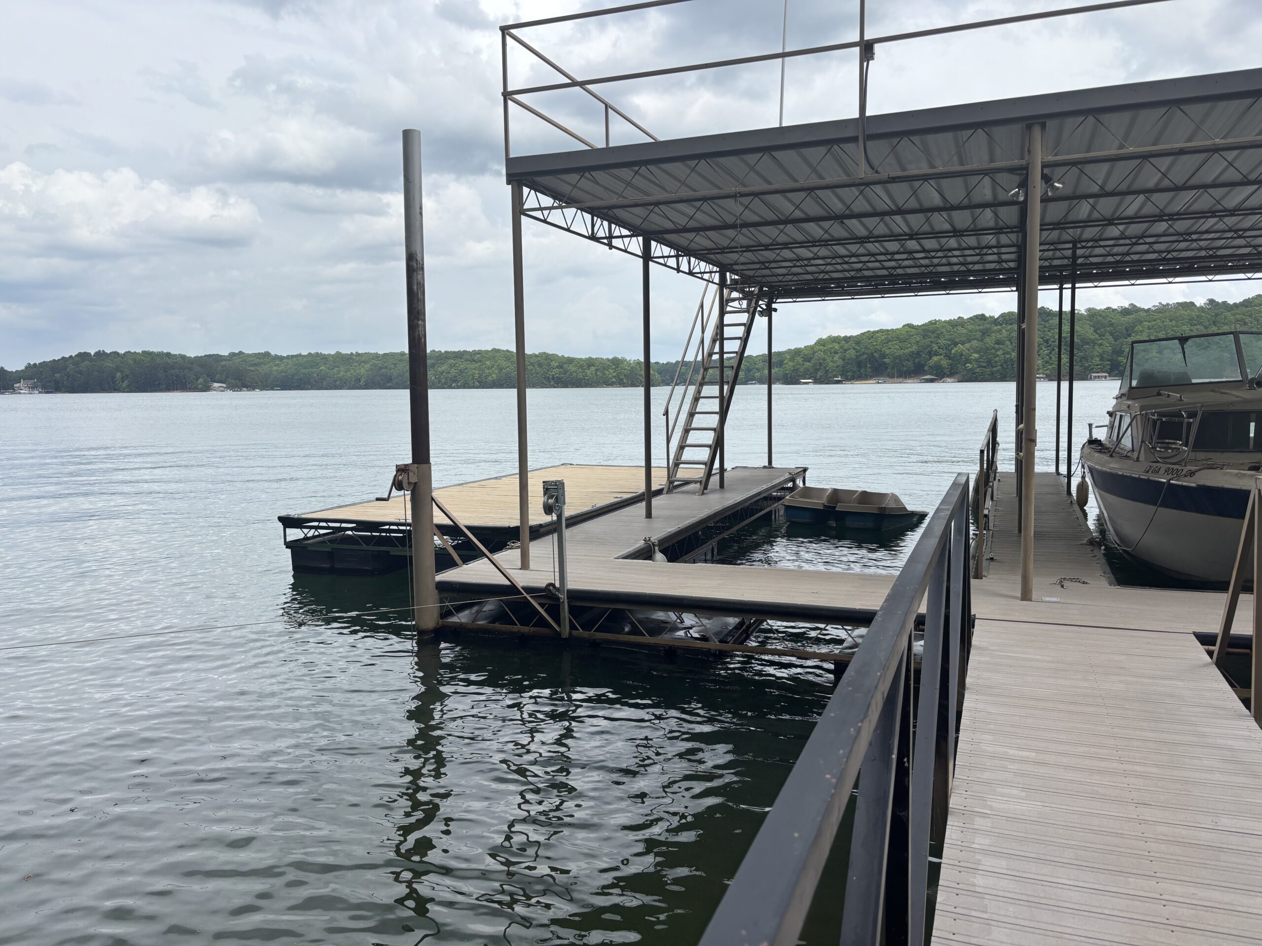A two slip boat dock with sundeck and swim platform on West Point lake